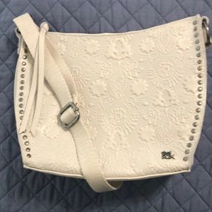 NWOT The Sak beige leather cross body bag with adj cotton strap. Never used